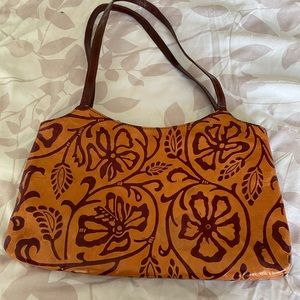 NWOT all leather shoulder bag. Orange w/deep red design